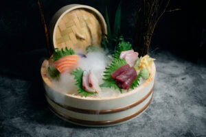Fresh sashimi platter presentation on ice, a safe and elegant gluten free sushi Miami option for celiacs at Paperfish